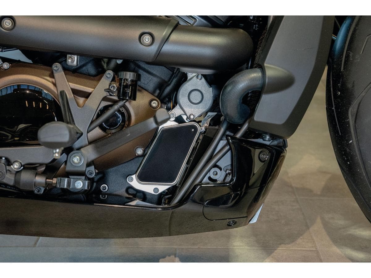 Heat exchanger cover plain design, easy installation (adhensive back) textured black, 21-24 sportster s rh1250s, 22-24 nightster rh975, 23-24 nightster special rh975s 1 Thunderbike
