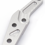 Caliper brckt clr Ohlins 11.5" l/h 00-up,